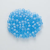BD00080-02-white-letter-light-blue-transparent-cube-alphabet-beads-mix-6mm